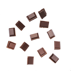 Falling  dark chocolate pieces isolated on white background, close-up.