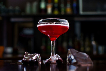 red berry cocktail on a beautiful bar background