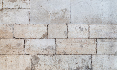 Close-up of an old and weathered wall or flooring made of cement blocks. High resolution full frame textured background.