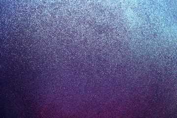 Sparkle glowing dark purple blue shade glitter of carborundum abstract textured background, can use for celebrate christmas day, new year day or birthday