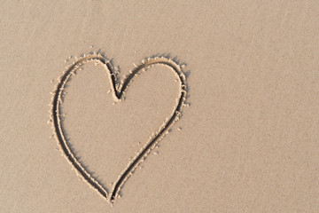 Heart shape on sand beach.