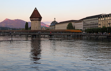 The Kapellbrücke (Chapel Bridge) is a covered wooden bridge crossing the Reuss River, located in the city of Lucerne, Switzerland.