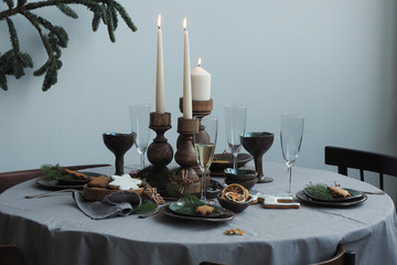 Round served table with festive vintage table setting...