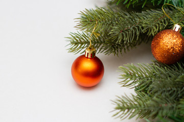Golden christmas ball on a branch of a christmas tree