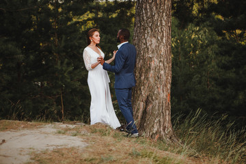 beautiful mixed couple of newlyweds