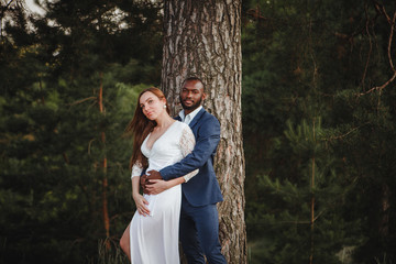 beautiful mixed couple of newlyweds