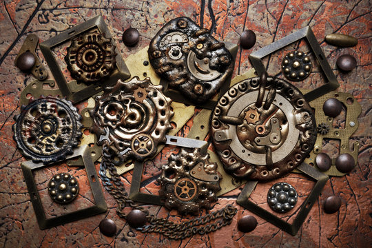 Composition of many brass parts and gears of different sizes. Steampunk background.