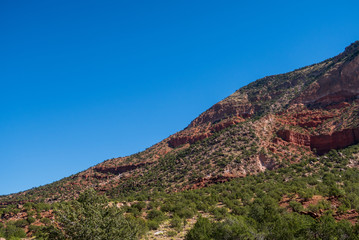Naklejka premium Low angle landscape of multi-colored hillside in Jemez Springs, New Mexico