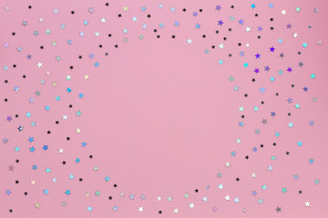 Circle glitter star decoration christmas happy new year frame on pink background with empty copy space