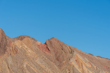 Fototapeta na wymiar Low angle landscape of barren yellow hillside in Lake Mead National Recreation Area in Nevada