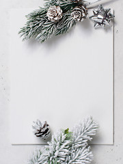 Christmas and new year goal planning mock up with note and branch on white background