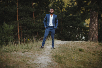 young african american man smiling. photo in the forest