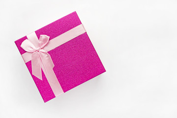 Red gift box with pink ribbon isolated on white background. Clipping path included.