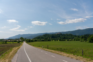 Rural landscape showing the road in the direction of Bled, a Slovenian town famous for its lake and castle