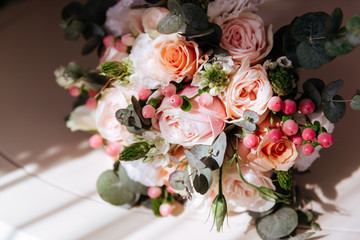 Wedding flowers, bridal bouquet closeup. Decoration made of roses, peonies and decorative plants