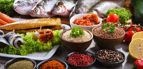 Different sorts of fish on kitchen table