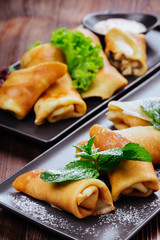 Delicious Tasty Homemade crepes or pancakes with raspberries and blueberries for breakfast
