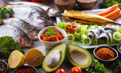 Different sorts of fish on kitchen table