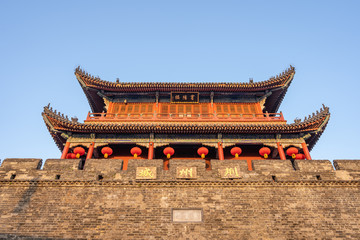 Traditional facade of buildings, exterior of buildings,loated Jingzhou China.Close-up of historic buildings.There china letters on building is"Jingzhou gate" builded in the Three Kingdoms Period.