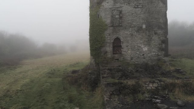 4k Aerial view of Merlin Castle in a foggy day, Galway, Ireland