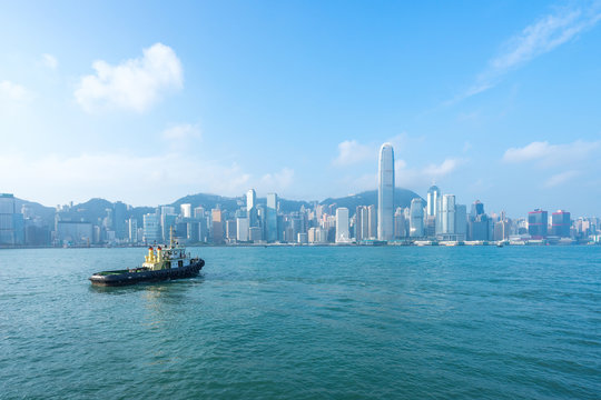 Hong Kong skyline cityscape,  boat at Victoria Harbor in morning 