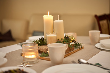 Festive table with candles. Christmas time.