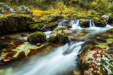 Fototapeta na wymiar Long exposure phtot of Mostnica river in Slovenia