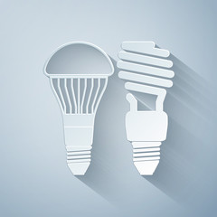 Paper cut Economical LED illuminated lightbulb and fluorescent light bulb icon isolated on grey background. Save energy lamp. Paper art style. Vector Illustration