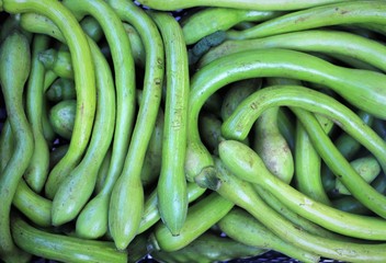 courgettes on display on a market counter