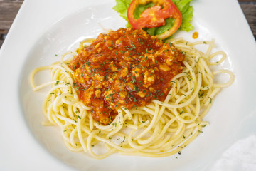 A portion of Italian spaghetti in white plate