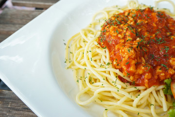 A portion of Italian spaghetti in white plate