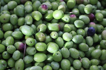 olives on display in a market stall