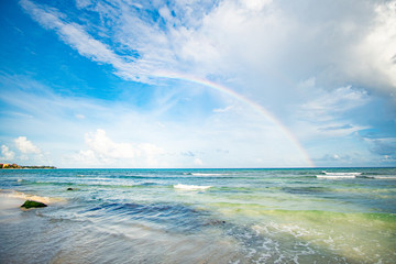 Half Rainbow and beautiful sky at the beach