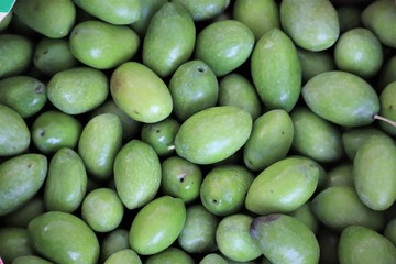 olives on display in a market stall