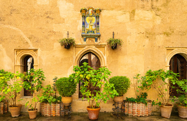 Fototapeta na wymiar Courtyard in the monastery of Guadalupe in Cáceres in Spain with an image of the Virgin Mary.