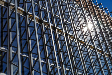 Extensive scaffolding providing platforms for work in progress on a new apartment block,Tall...