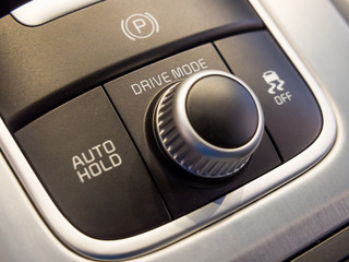 Passenger drive mode selection dial and lock button