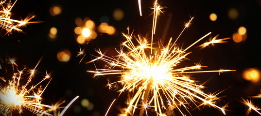 sparkler on black background, burning sparkler firework. Happy new year and Merry christmas...