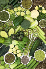 Vegan health food diet concept with plant based green foods of fruit & vegetables, herbs, seeds,...