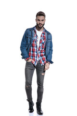 Fototapeta premium sexy fashion model in plaid shirt holding hand in pocket