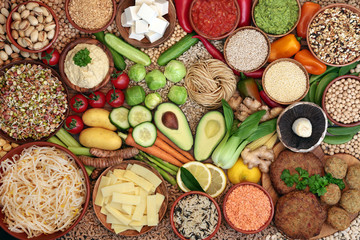 Vegan health food diet concept with a large collection of foods. High in protein, vitamins, minerals, antioxidants, anthocyanins, fibre, protein, omega 3 and smart carbs. Flat lay.