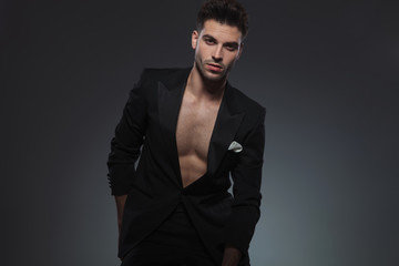 Obraz premium fashion cool guy sitting in a fashion pose