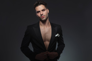Fototapeta premium young fashion man adjusting jacket