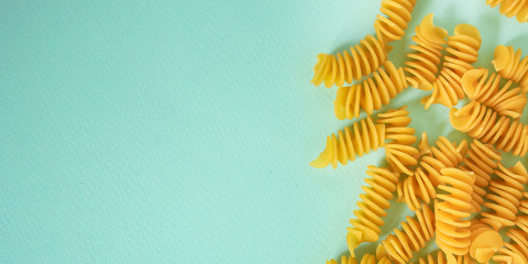 Fototapeta na wymiar pasta Rotini, fusilli, radiatori (set of ingredient, raw pata italian). top food background. copy space