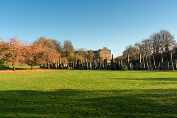 The sunny autumn day of the old Victorian cemetery Necropolis. Religion and death theme. 