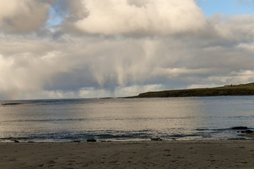 rain cloud over sea