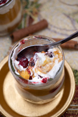 Christmas pumpkin and cramberry mousse served in individual glasses