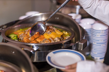 Food Buffet Catering Dining Eating Party Sharing Concept.people group catering buffet food indoor in luxury restaurant with meat colorful fruits and vegetables