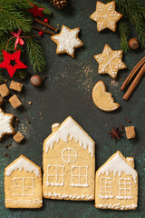 Christmas gingerbread cookies and ingredients for baking. Culinary background. Top view flat lay background with copy space.