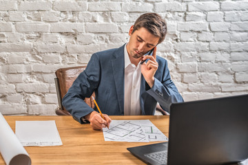 civil engineer at his Desk working with documents